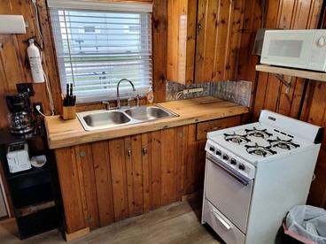 Lakefront Cottage with Fire Pit, Beach & Pet Friendly in Houghton Lake, Michigan - Houghton Lake, Michigan - glamping.directory