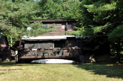 Waterfront Getaway Cabin with a Fire Pit on Raquette Lake, New York - glamping.directory