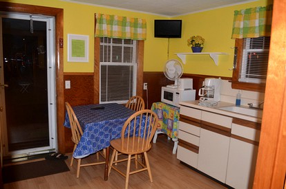 Lovely Lakefront Cottage Rental with Private Beach in New Hampshire - Weirs Beach, New Hampshire - glamping.directory