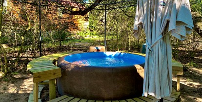 Secluded Cabin Rental with Jacuzzi for Romantic Weekend Getaway near Austin, Texas - Cat Spring, Texas - glamping.directory