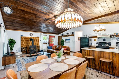 River Cabin with Hot Tub, Fire Pit, Screened Porch and Plenty of Outdoor Activities to Keep Your Group Busy in Great Cacapon, WV - Great Cacapon, West Virginia - glamping.directory