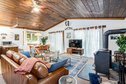 River Cabin with Hot Tub, Fire Pit, Screened Porch and Plenty of Outdoor Activities to Keep Your Group Busy in Great Cacapon, WV - Great Cacapon, West Virginia - glamping.directory