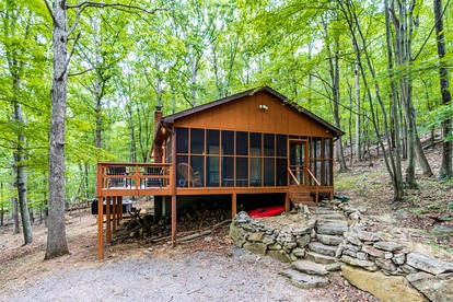 River Cabin with Hot Tub, Fire Pit, Screened Porch and Plenty of Outdoor Activities to Keep Your Group Busy in Great Cacapon, WV - glamping.directory