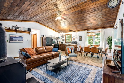 River Cabin with Hot Tub, Fire Pit, Screened Porch and Plenty of Outdoor Activities to Keep Your Group Busy in Great Cacapon, WV - Great Cacapon, West Virginia - glamping.directory
