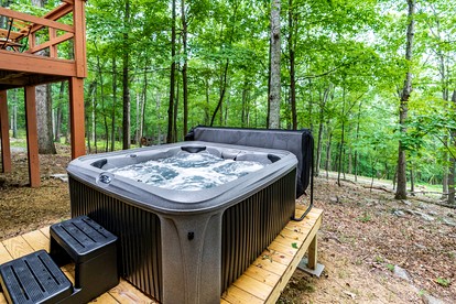 River Cabin with Hot Tub, Fire Pit, Screened Porch and Plenty of Outdoor Activities to Keep Your Group Busy in Great Cacapon, WV - Great Cacapon, West Virginia - glamping.directory