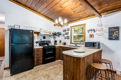 River Cabin with Hot Tub, Fire Pit, Screened Porch and Plenty of Outdoor Activities to Keep Your Group Busy in Great Cacapon, WV - Great Cacapon, West Virginia - glamping.directory