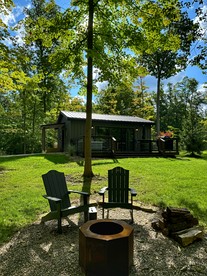 Serene Modern Cabin with Hot Tub Surrounded by Nature for a Romantic Escape near Madison, Ohio - glamping.directory