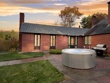 Charming Brick Retreat with Hot Tub & Mountain Views in Conway, New Hampshire - glamping.directory
