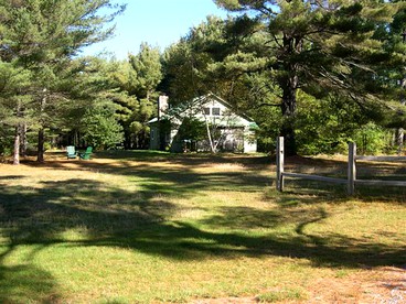 Seven-Person Cabin Rental with Stone Fireplace Overlooking Lake Paradox in Adirondacks - Severance, New York - glamping.directory