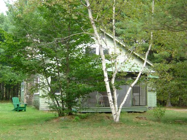 Seven-Person Cabin Rental with Stone Fireplace Overlooking Lake Paradox in Adirondacks - glamping.directory