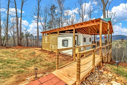 Cozy Mountain Camper Retreat with Private View Deck & Fire Pit in Old Fort, North Carolina - glamping.directory