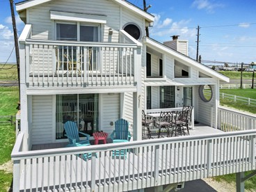 Charming Beach House with Breathtaking Ocean View and Spacious Decks in Jamaica Beach, Texas - Jamaica Beach, Texas - glamping.directory