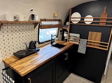 Luxurious Remodeled Airstream with Wraparound Deck and Spa near Honey Grove, Texas - Honey Grove, Texas - glamping.directory