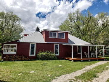 Charming Montana Bungalow with Madison River Views, Steps from Main Street in Ennis, MT - glamping.directory