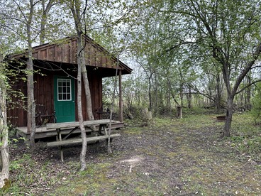 Cozy Rustic Cabin with Fire Ring & Outdoor Seating in Macedon, New York - glamping.directory