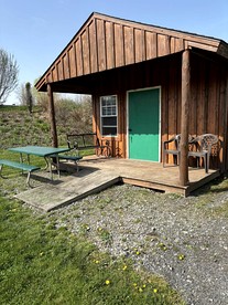 Peaceful Cabin Retreat with Picnic Table & Nature Views in Macedon, New York - glamping.directory