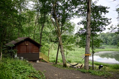 Beautifully Restored Historic Scout Cabin with Pond View for a Peaceful Romantic Escape in Troy, Wisconsin - glamping.directory