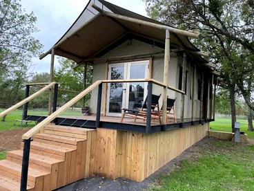 Romantic Lakefront Cabin with Fire Pit near Lake Bastrop, Texas – Luxury Glamping Escape for Couples - glamping.directory