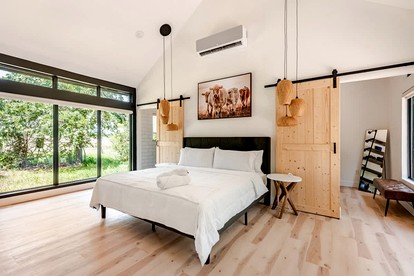 Tranquil Modern Cabin with Friendly Farm Animals & Pond Views Near Cedar Creek, Texas - Cedar Creek, Texas - glamping.directory