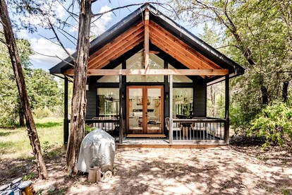 Tranquil Modern Cabin with Friendly Farm Animals & Pond Views Near Cedar Creek, Texas - glamping.directory