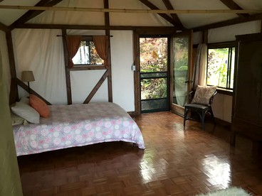 Romantic Cottage for Couples in the Heart of Nature at Yoga Retreat in Captain Cook - Captain Cook, Hawaii - glamping.directory