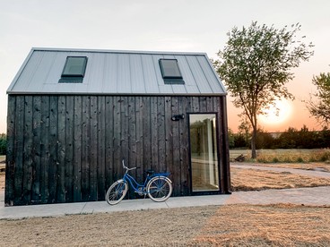 Modern Loft Cabin with Skylights, Paddle Boards & Trail Access in Humboldt, Kansas - glamping.directory