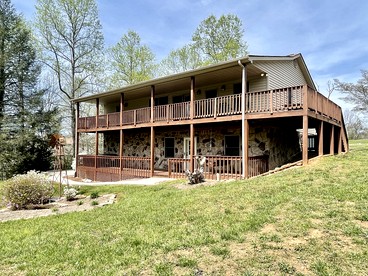 Gorgeous Cottage Nestled Amidst Trees with Foosball and Pool Table in Sevierville, Tennessee - glamping.directory