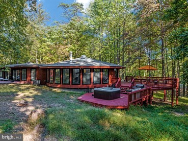 Modern Cabin with Hot Tub, Fire Pit and Grill in Hedgesville, WV - glamping.directory