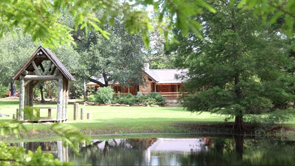 Rustic Lodge Getaway with Large Patio and Pond near Lufkin, Texas - Huntington, Texas - glamping.directory