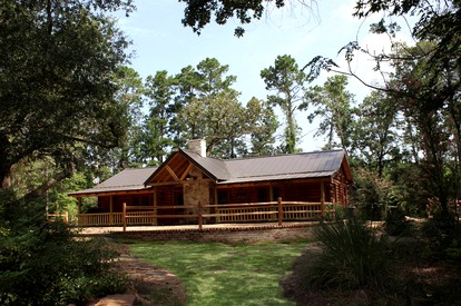 Rustic Lodge Getaway with Large Patio and Pond near Lufkin, Texas - glamping.directory