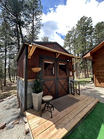 Quaint Rustic Cabin Surrounded by Nature in Black Forest, Colorado - glamping.directory