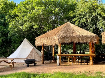 Relaxation and Fun Combined Glamping Tents M & In-Water Picnic Table L in Kingsbury, TX - glamping.directory