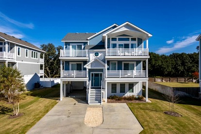 Spacious Coastal Retreat with Pool, Hot Tub, Game Room & Private Balconies in Corolla, North Carolina - glamping.directory