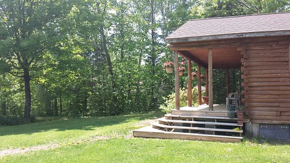 Rustic Camping Cabin with Fireplace in Private Woods near Bangor, Maine - Exeter, Maine - glamping.directory