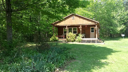 Rustic Camping Cabin with Fireplace in Private Woods near Bangor, Maine - Exeter, Maine - glamping.directory
