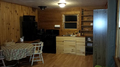 Rustic Camping Cabin with Fireplace in Private Woods near Bangor, Maine - Exeter, Maine - glamping.directory