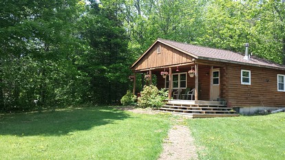 Rustic Camping Cabin with Fireplace in Private Woods near Bangor, Maine - Exeter, Maine - glamping.directory