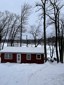 Little Red Cabin Rental by the Lake for a Weekend Getaway in Wisconsin - glamping.directory