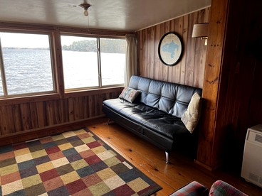 Serene Lakefront Cabin with Picture-Window Fishing Beside Covered Boathouse in Orr, Minnesota - Orr, Minnesota - glamping.directory