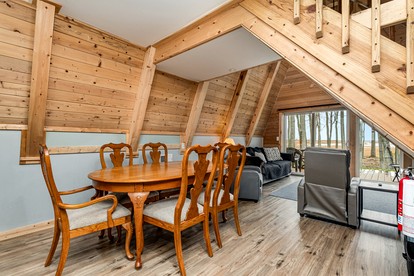 Lakefront A-Frame with Lofted Interior Ideal for Outdoor Activities in Michigan - Au Gres, Michigan - glamping.directory