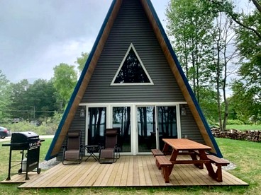 Lakefront A-Frame with Lofted Interior Ideal for Outdoor Activities in Michigan - glamping.directory