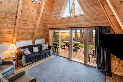 Lakefront A-Frame with Lofted Interior Ideal for Outdoor Activities in Michigan - Au Gres, Michigan - glamping.directory