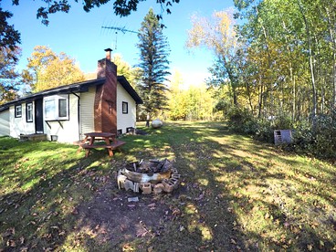 Secluded Lake Cottage Rental with a Dock and a Game Room in Hale, Michigan - glamping.directory