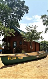 Relaxing Lakefront Cabin with Hot Tub, Starry Nights, Trails & Scenic Vineyards in Texas - glamping.directory