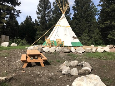 Cozy Tipi with Bunk Bed and Resort Amenities near Hall, Montana - glamping.directory