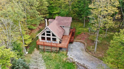 Luxury Lakeside Mountain Escape with Wraparound Deck Near Terra Alta, West Virginia - glamping.directory