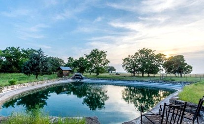 Romantic Log Cabin Retreat with Private Hot Tub Located in Fredericksburg, Texas - Fredericksburg, Texas - glamping.directory