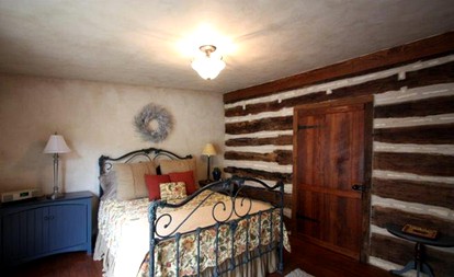 Romantic Log Cabin Retreat with Private Hot Tub Located in Fredericksburg, Texas - Fredericksburg, Texas - glamping.directory