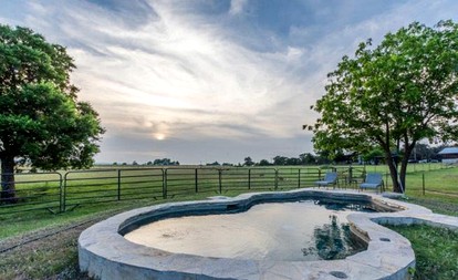 Romantic Log Cabin Retreat with Private Hot Tub Located in Fredericksburg, Texas - Fredericksburg, Texas - glamping.directory