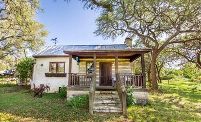Romantic Log Cabin Retreat with Private Hot Tub Located in Fredericksburg, Texas - Fredericksburg, Texas - glamping.directory